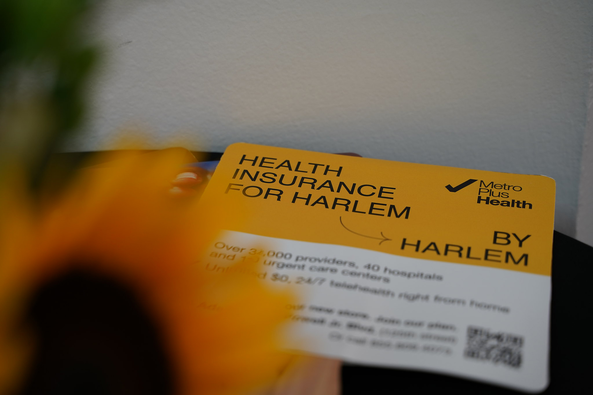 A sign saying health insurance for Harlem by Harlem