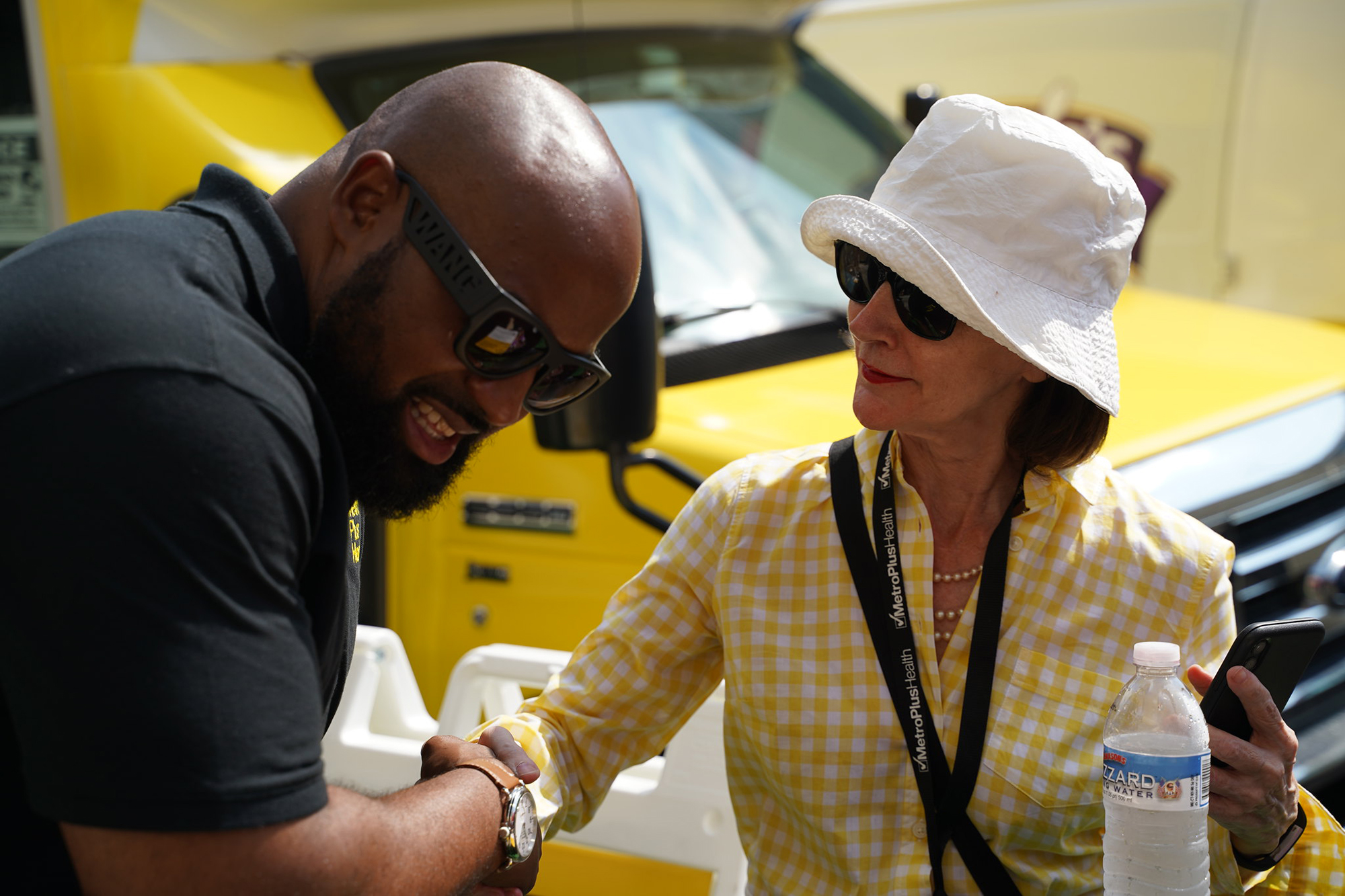 A man and woman shake hands