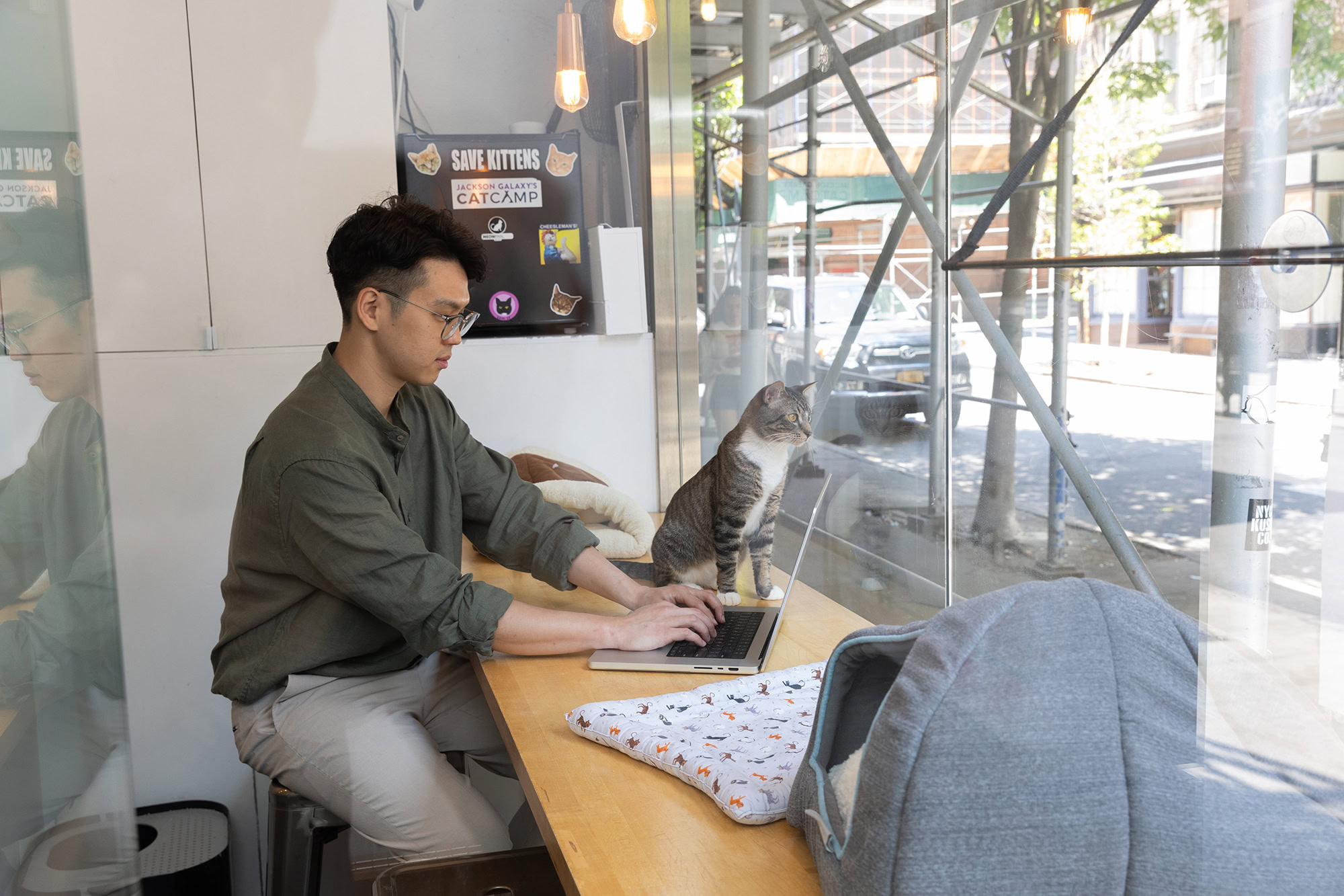 MetroPlusHealth representative speaking with a member at a customer service desk in NYC.
