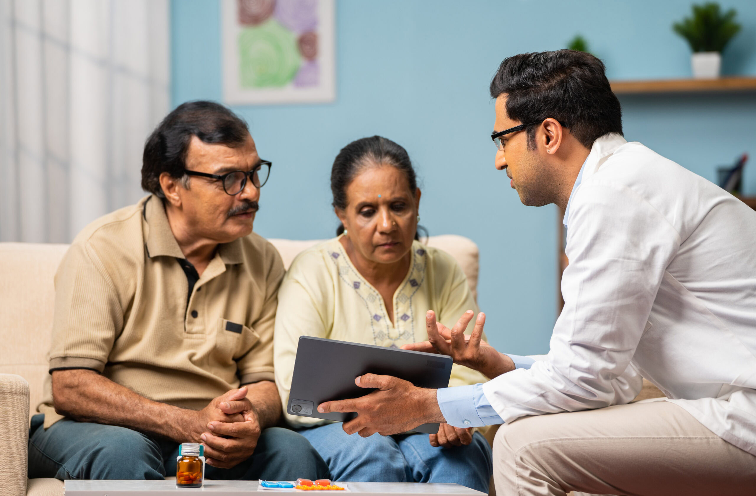 Smiling senior woman reviewing health documents with her doctor.