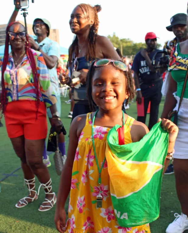 Children and adults participating in aCarribean Heritage Summer Workshop, celebrating Guyanese culture.