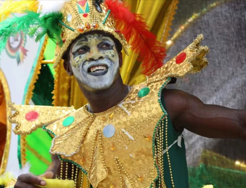 Families gathered at the Guyana Folk Festival: Family Fun Day, enjoying live performances, games, and cultural activities.
