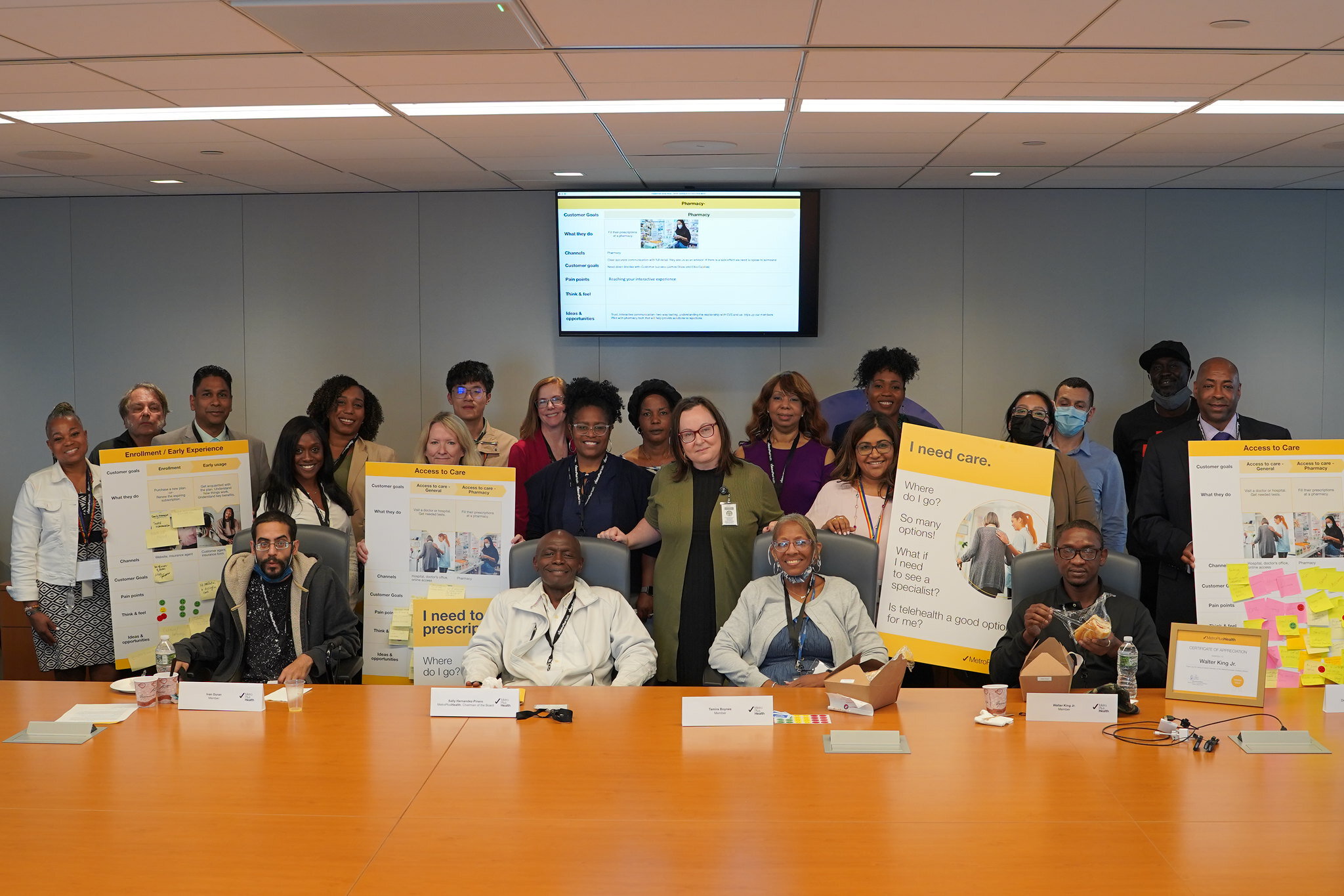 Diverse group of MetroPlusHealth members engaged in a discussion at a Member Advisory Board meeting.