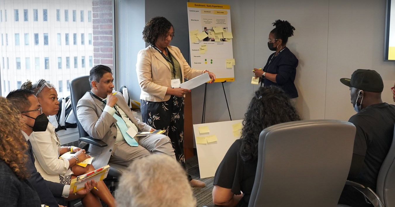 A MetroPlusHealth Member Advisory Board meeting in progress, with members sharing ideas and feedback.
