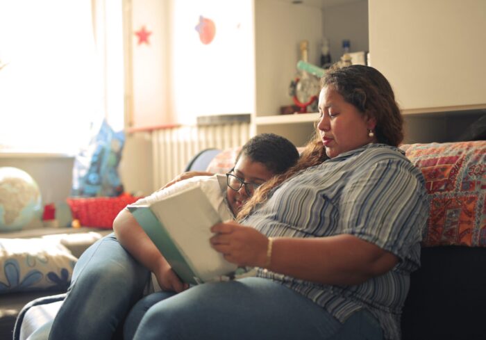 Family in New York meeting with a MetroPlusHealth provider to review SilverPlus Plan health coverage.
